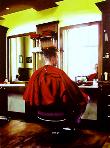 dependency- hyperrealism acrylic painting by artist painter Gerard Boersma showing a man getting a haircut at barber shop