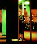Call- hyperrealism acrylic painting by artist painter Gerard Boersma showing a nightscene in a city of a woman making a call in a KPN  telephonebooth, Leeuwarden