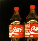 Coca Cola bottles- hyperrealism acrylic still life painting by artist Gerard Boersma showing coca cola bottle