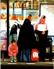 Dirk- hyperrealism painting by artist Gerard Boersma showing muslim women waiting for tram at central station in Amsterdam