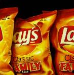 family - hyperrealism acrylic still life painting by artist Gerard Boersma showing bags of lays chips classic family size