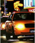 headlights- hyperrealism painting by artist Gerard Boersma showing a yellow cab in New York