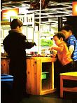 corner- hyperrealism acrylic painting by artist painter Gerard Boersma showing children playing with wooden toys in ikea store