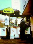 chain- hyperrealism acrylic painting by artist painter Gerard Boersma showing a woman in front of Sabrett hotdog stand at Guggenheim museum New York