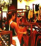 the outfit- hyperrealism acrylic painting by artist painter Gerard Boersma showing women in clothing store looking for clothes