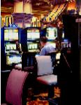 Slot Machines, painting of man hitting the slot machines in Las Vegas