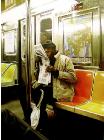 Surrounding- hyperrealism public transport painting of a man riding the New York subway metro by artist Gerard Boersma