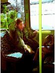 Stadsbus- hyperrealism subway and transport painting of woman with down syndrome riding the bus by artist Gerard Boersma
