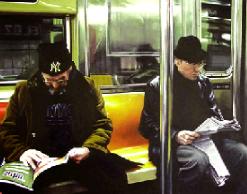 subway- hyperrealism painting by artist Gerard Boersma showing two men riding subway metro in New York