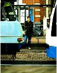trams- hyperrealism painting by artist Gerard Boersma showing a man trapped between two trams at leidseplein in Amsterdam
