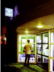 employment agency- hyperrealism acrylic painting by artist painter Gerard Boersma showing a man in fron of employment agency Randstad at night in Leeuwarden