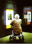exception- hyperrealism acrylic painting by artist painter Gerard Boersma showing a nightscene cityscape of old elderly woman in front of ATM cashmachine pinautomaat ING bank, rollator, Leeuwarden, orignally painted for  Leeuwarder Courant Kerstbijlage