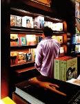 Big Books, hyperrealism painting by Gerard Boersma of man in Taschen bookstore, Beverly Hills 