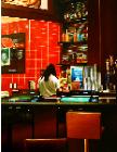 Las Vegas Bar- hyperrealism acrylic painting by artist painter Gerard Boersma showing a woman working in a bar in Las Vegas