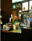 Starbucks- hyperrealism hyperrealism acrylic painting by artist painter Gerard Boersma showing a man working in Starbucks, Las Vegas